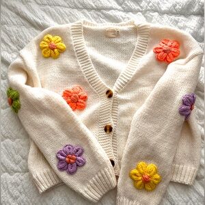 A cozy and adorable flower knit sweater perfect for any season. Worn only twice!